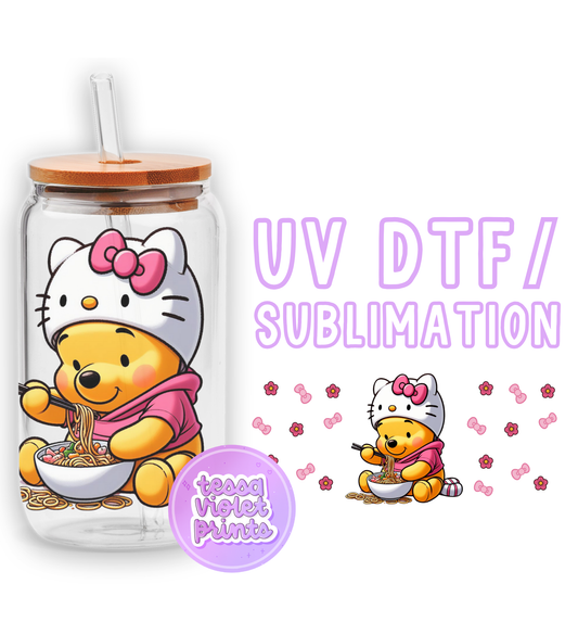 a hello kitty drinking out of a cup