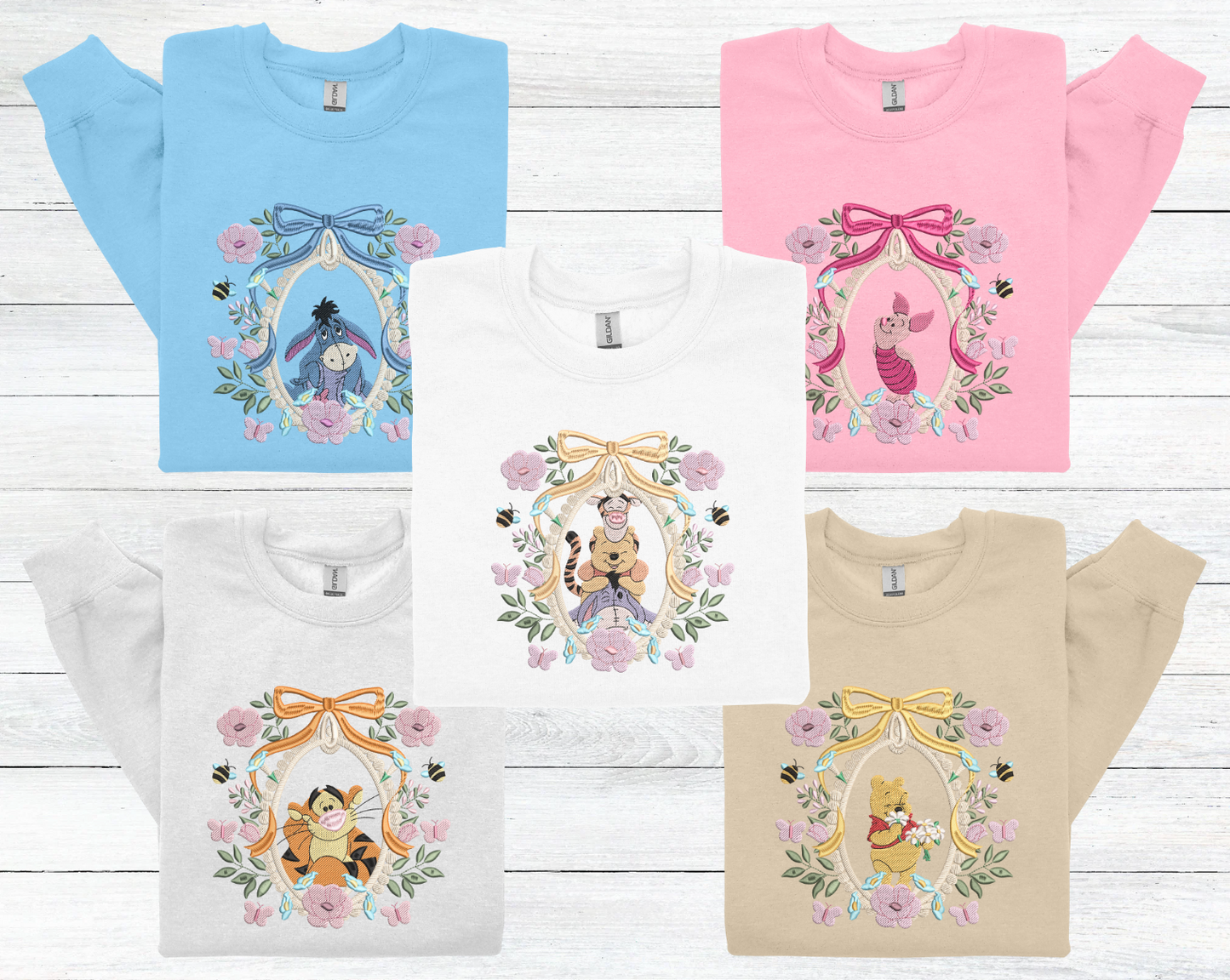 a group of four tshirts with winnie the pooh on them