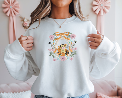 a woman wearing a sweatshirt with a cartoon character on it