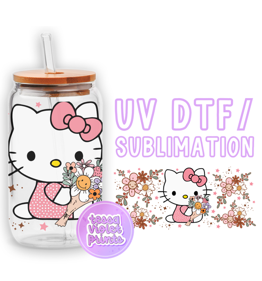 a hello kitty water bottle with a straw in it