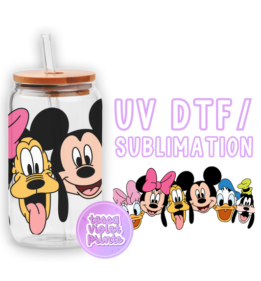 a glass cup with a mickey mouse face on it