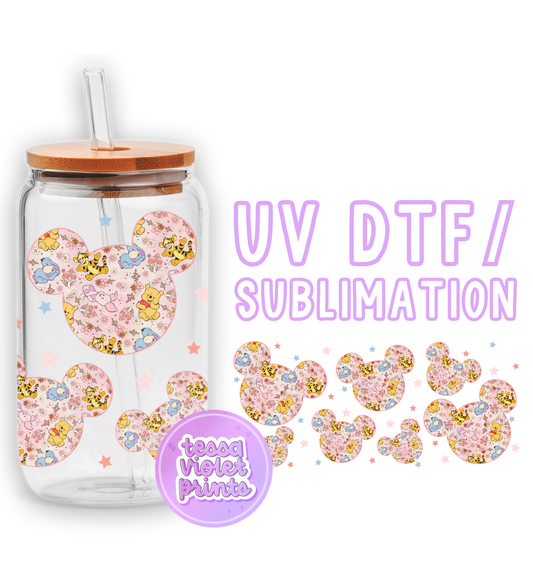 a glass jar with glitter hearts and a straw in it